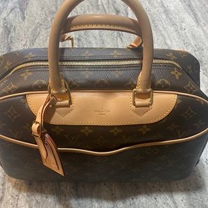 Never carried just stored Louis Vuitton The Deauville. Lock & keys included.